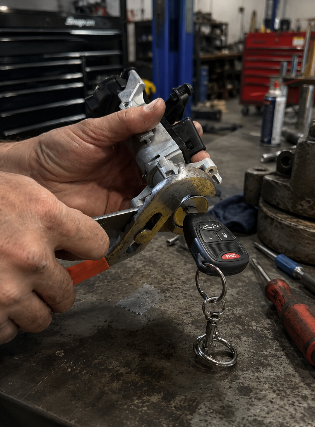 Ignition cylinder repair in progress on the workshop bench